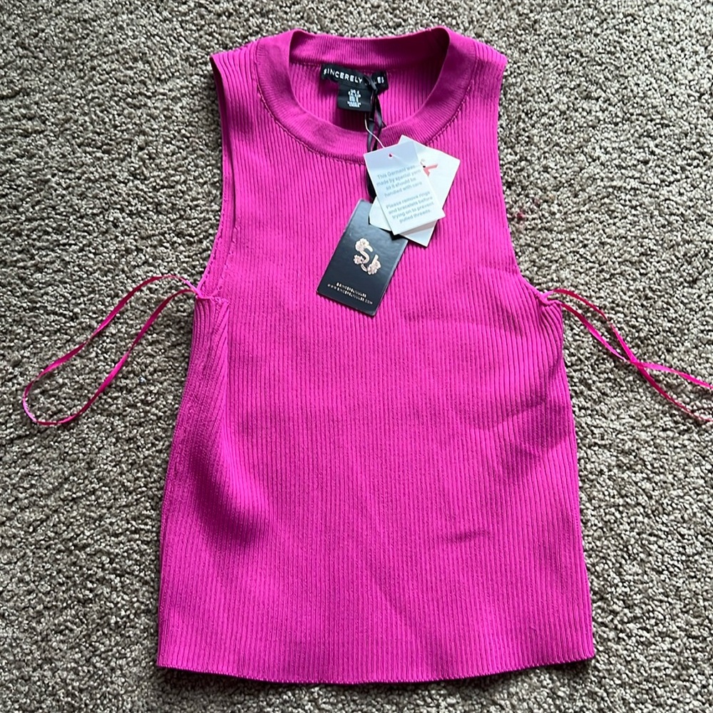 Magenta knitted sweater tank top fits woman’s small and brand new with tags